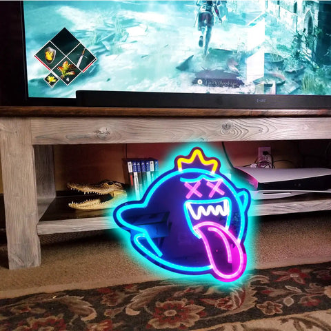 Totally Lit Ghost Neon Sign LED Light with dimmable switch, colorful rainbow glow, placed on a wooden shelf near a TV.