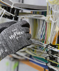 Person wearing foam nitrile coated work gloves gripping wires, showcasing superior grip in dry wet and oily conditions, XL size, 12 pack.