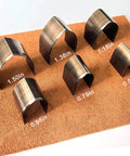 Leather Corner Punch Set With 18 Pieces In 6 Sizes And 3 Shapes, showing 6 pro-grade high carbon steel corner cutters on mat