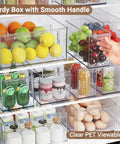 Clear Plastic Storage Bins With Dividers 3 Pack Acrylic Stackable Organizer Boxes for Fridge with fruits and drinks.