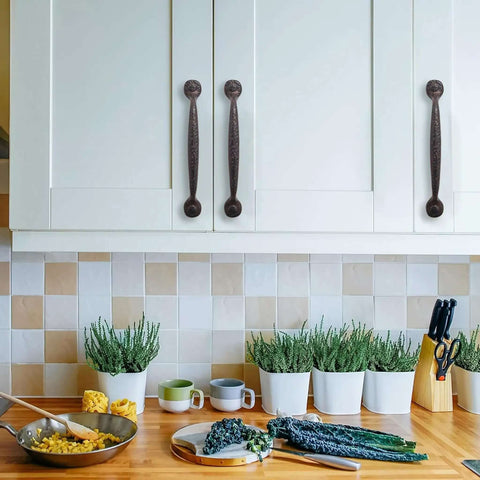 Kitchen scene with 10 Pack 8 Inch Hole Center Rustic Iron Cabinet Pulls With Hammered Antique Finish on white cabinets