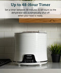 Compact Food Dehydrator With 5 Spacious Trays, Adjustable 95 To 165 Fahrenheit Temp, 48 Hour Timer on kitchen countertop.