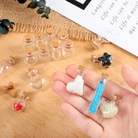 Big Time Favorite Mini Glass Jars With Cork Stoppers, 50 Pack Super Cute Wishing Bottles In 10 Unique Styles, various filled jars in hand.