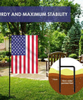 Premium Heavy Duty Garden Flag Holder Stand With Rugged All Weather Metal Flagpole And Secure Clip Included Built Tough For Windy Days And Year Round Backyard Display in garden setting with American flag.