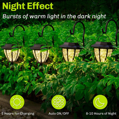 4 Pack Solar Pathway Lights With Shepherd Hook Hangers, illuminating a garden at night with warm 3000K ambience.