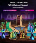 Tri Color Silk PLA Filament 1.75mm 1Kg spools with colorful 3D prints, showing red, blue, green hues and glossy finish.