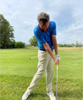 Golfer using Golf Belt Laser And Rod Mount For Swing Training And Putting Alignment Securely Attaches To Back Chest Or Hip outdoors