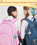 Two girls with backpacks showcasing Epic 58mm Button Maker Kit for Keychains with custom badge keychains attached.