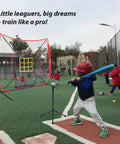 Young player using 7 By 7 Foot Baseball And Softball Practice Net With Stable Bow Frame And Heavy Duty Mesh Strike Zone Target Ultra Portable Pitching Net For All Ages And Skill Levels on field.