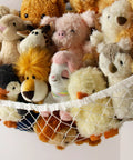 Corner Hanging Stuffed Animal Storage Hammock Net For Plush Toys Large Capacity Toy Organizer filled with various stuffed animals.