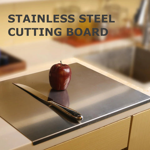 Top view: stainless steel cutting board, 40 x 30 cm, on kitchen counter with knife and apple.