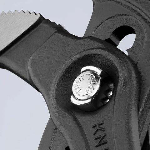 Close-up of a Quick-Adjust feature on the Three Piece Ten Inch Pliers Set With Quick Adjust Cobra Pliers On The Workpiece.