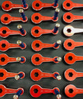 Multiple 3/4 Inch Quick Vise Handles With Spring Plunger For Easy On Off, Fits Kurt Vises, red color, arranged in rows