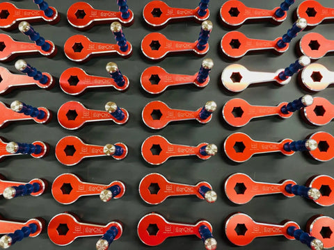 Multiple 3/4 Inch Quick Vise Handles With Spring Plunger For Easy On Off, Fits Kurt Vises, red color, arranged in rows
