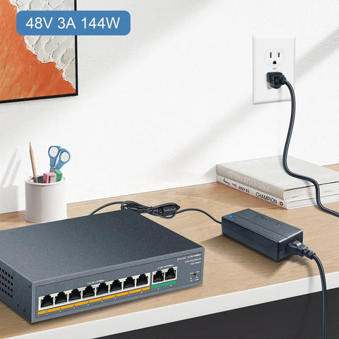 Beefy 48V 3A Power Supply For POE Switch And CCTV Camera, 144W AC/DC Adapter placed next to a network switch on desk