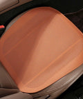 Stylish Leather Car Seat Cushion For Mini Roadster And Countryman featuring breathable perforated surface, orange color, and non-slip base.