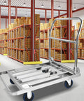 Heavy Duty Foldable Platform Push Cart With Smooth Rolling Rubber Wheels And Slick Stainless Steel Frame in a warehouse.