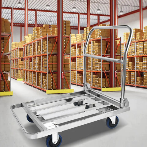 Heavy Duty Foldable Platform Push Cart With Smooth Rolling Rubber Wheels And Slick Stainless Steel Frame in a warehouse.
