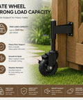 Heavy Duty Workhorse 4 Inch Galvanized Steel Gate Wheels With Locking Foot Brake Black 2 Pack Rust Resistant Outdoor Casters installed on a wooden gate.
