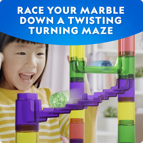 Child playing with Glowing Marble Run Kit With 15 Glow-In-The-Dark Glass Marbles And Storage Bag, colorful maze tracks