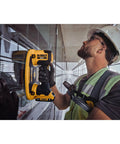 DeWalt 20v Max Cordless Grabo Vacuum Suction Lifter With Built In Pressure Sensor For Heavy Materials Up To 265 Lbs Bare Tool Only held by worker on glass.