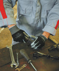 Pro Grade Nitrile Work Gloves With Breathable Fit And High Dexterity Grip For Landscaping, Gardening, And Assembly, black, X Large, in use for assembly at workbench.