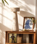 Travertine Stone Table Lamp With Warm White LED on wooden console with art, Japanese Wabi Sabi Mushroom Nightstand Light
