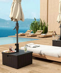 All In One Outdoor Umbrella Base With Rolling Wheels And Planter Box 176 Lb Heavy Duty Sand Fillable, used as a table by a pool