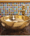 Gorgeous Gold Ceramic Round Vessel Sink Adds Fresh Flair For Your Bathroom Vanity Top Shelf Countertop Wash Basin shown above a stylish faucet.