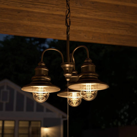Broadcast 3 Light Outdoor Chandelier in oil rubbed bronze with copper highlight finish on patio at night