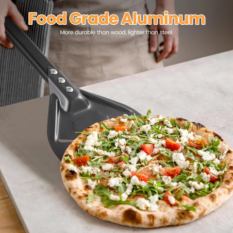 Side view of gray aluminum pizza turning peel lifting a freshly baked pizza.
