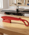 Rock Solid Table Saw Push Stick With Riving Knife Splitter 16.5 Inches Long on wooden table in workshop setting.