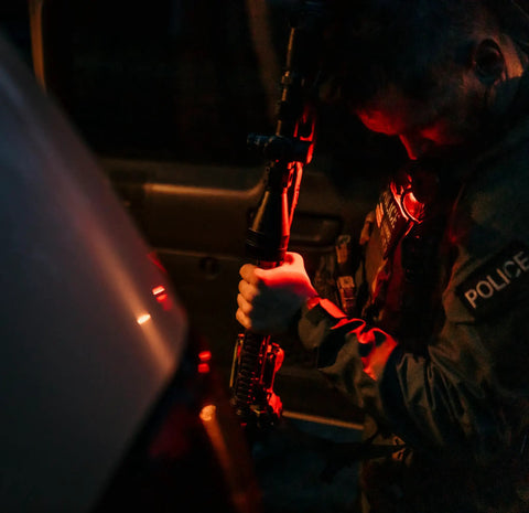 Person using Quad 4 LED Tactical Headlamp With Focused Wide Beam And Multiple Modes For Bright Close Up Lighting And Long Range Power