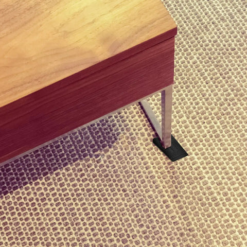 Adjustable Furniture Leveling Shims And No Slip Appliance Stability Pads under sofa leg for balance and floor protection.