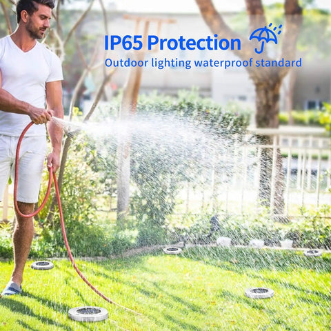 8 LED Solar Disk Lights In Ground Outdoor Landscape Lighting demonstrating IP65 waterproof feature in garden setting