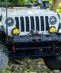 Beefy 13,500 Lb Synthetic Rope Winch For Trucks And SUVs, 12V IP68 Waterproof Motor, Wireless And Wired Remote, Heavy Duty Off Road Tow Winch For Trailers And UTVs Tank Series mounted on a Jeep bumper
