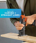 Person using Matrix Jig Saw Attachment for Cordless Drill With Tool Free Blade Change And Variable Speed Compact Design For Tight Spaces Accepts U And T Shank Blades Ideal For Precise Cuts On The Go, cutting wood