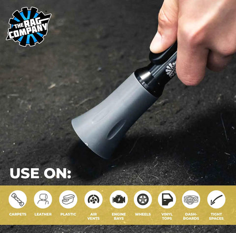 Person using Ultra Air Blaster Mini Car Detailing Tool on carpet for cleaning hard-to-reach spots.