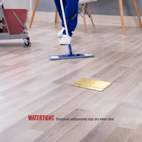 Dual Pop Up Floor Box Kit With Brass Cover, 20A Tamper Resistant Receptacles And RJ45 Data Ports on wooden floor, watertight