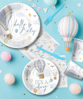 Blue Hot Air Balloon Baby Shower Tableware Set for Boy Disposable Plates Cups Napkins and Cutlery Serves 24 Adventure Awaits Theme Party Supplies for the Baby Shower Celebration on blue background.