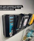 Dual Charger Wall Mount For Makita DC18RC Double Chargers 2 Pack, mounted with batteries in workshop setting.