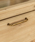 Installed view of Ten Pack 5 Inch Antique Brass Cabinet Pulls for Kitchen Cabinets and Bathroom Vanities on wooden drawer