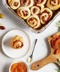 Baked rolls in 35 Pack 8x8 Inch Square Baking Pans With Snap-On Plastic Dome Lids on a marble counter with apricots and marmalade