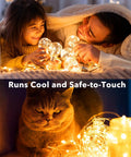 Family and cat enjoying 24 Pack Battery Operated Fairy Lights On Silver Wire 7 Ft Long With 20 LEDs Waterproof Firefly String Lights