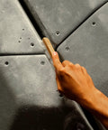 Hand using Best Ever Climbing Brush For Chalk And Bouldering Vegan Chalk Bag Friendly Rock Climbing Brush Ultra Efficient Chalk Remover Durable Grip Perfect For Gym And Outdoor Climbing on rock hold