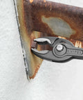 Slim Front And Side Grip Pliers With Box Joint And Push Button Adjustment For Tight Spots, 200 Mm, gripping metal edge.