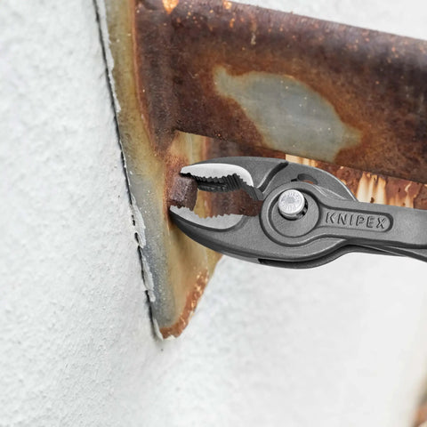 Slim Front And Side Grip Pliers With Box Joint And Push Button Adjustment For Tight Spots, 200 Mm, gripping metal edge.