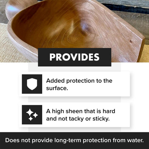 Top Shelf Wood Finish Paste Wax For Furniture Cabinets And Tabletops Blends Carnauba And Beeswax on a polished wooden surface.