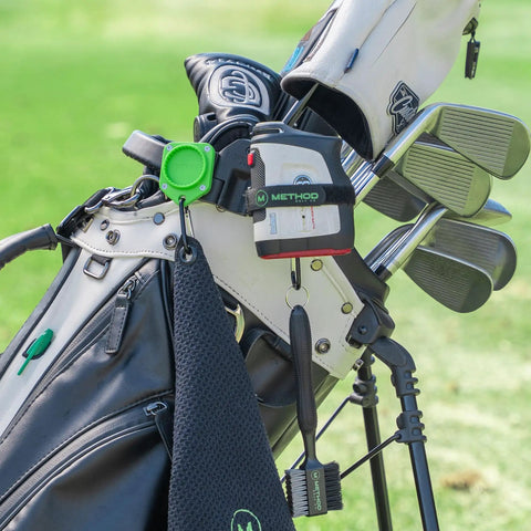 BagStack Gear Hub Starter Pack Magnetic Golf Gear Organizer with landing pad holding towel, brush, and rangefinder on golf bag