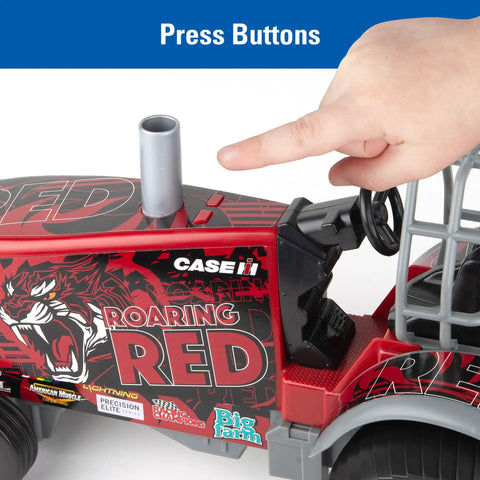 Case IH Barn Buster One Sixteenth Scale Pulling Tractor With Thunder Engine Sounds, child pressing button to activate sound feature.